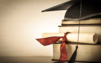 A graduation cap and books.