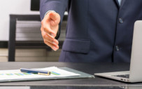 Man extending arm to shake hands