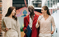 A group of women talking in the office.