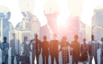 Silhouettes of people superimposed on a collage of buildings in the background.